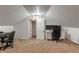 Finished attic space with neutral carpet, ideal for a home office, complete with desk and storage at 718 E Washington St, Lebanon, IN 46052