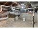 A basement featuring exposed pipes, unfinished walls, and a concrete floor at 718 E Washington St, Lebanon, IN 46052