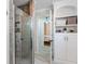 Stylish bathroom features a glass shower, built-in shelving, and an ensuite bedroom access at 718 E Washington St, Lebanon, IN 46052