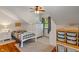 Cozy bedroom with a ceiling fan, dresser, and built-in shelving for practical storage solutions at 718 E Washington St, Lebanon, IN 46052