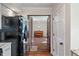 Inviting entryway to room with beautiful wood floors, and French doors leading into the living space, viewed from the kitchen at 718 E Washington St, Lebanon, IN 46052