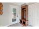 Mudroom-style entryway with charming wooden hall tree and coat hooks at 718 E Washington St, Lebanon, IN 46052