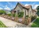 Charming home featuring a decorative fence, landscaped yard and classic architectural design at 718 E Washington St, Lebanon, IN 46052