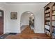 Inviting foyer featuring hardwood floors, a decorative archway, and a view into the adjoining living spaces at 718 E Washington St, Lebanon, IN 46052