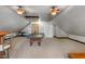 Spacious game room with a ping pong table, ceiling fans, and shelving for storage and decor at 718 E Washington St, Lebanon, IN 46052