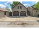 Three-car garage featuring an extra-wide driveway at 718 E Washington St, Lebanon, IN 46052