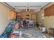 Cluttered garage interior, cabinets, and storage racks at 718 E Washington St, Lebanon, IN 46052