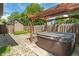 A hot tub sitting on a concrete pad in a fenced backyard at 718 E Washington St, Lebanon, IN 46052