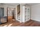 Inviting living room boasts hardwood floors, built-in shelving and staircase access to the upper level at 718 E Washington St, Lebanon, IN 46052