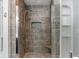 Modern bathroom shower with decorative tile, rainfall showerhead, and built-in niche at 718 E Washington St, Lebanon, IN 46052