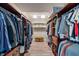 Expansive walk-in closet features custom shelving, organized storage, and hardwood floors at 718 E Washington St, Lebanon, IN 46052