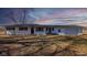 Inviting exterior showcasing a one-story home with a well-maintained lawn and attached garage at 7300 N Banta Rd, Bargersville, IN 46106