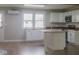 Modern kitchen features granite counters, white cabinets and stainless steel appliances at 7300 N Banta Rd, Bargersville, IN 46106