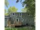 Backyard featuring a wooden deck off the side of a two-story home at 7529 N Green Meadows, Fairland, IN 46126