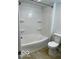 A full bathroom with a white shower-tub and a low-flow toilet for efficiency at 7529 N Green Meadows, Fairland, IN 46126