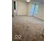 This bedroom features plush carpeting and a window letting in natural light at 7529 N Green Meadows, Fairland, IN 46126