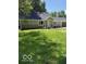 Charming one-story home with a manicured front yard and attached one car garage at 7529 N Green Meadows, Fairland, IN 46126