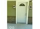 A well-lit front entry features a front door with decorative glass at 7529 N Green Meadows, Fairland, IN 46126