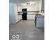 Bright kitchen featuring white cabinets, granite countertops, and updated appliances at 7529 N Green Meadows, Fairland, IN 46126