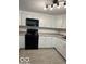 Charming kitchen features white cabinetry, stainless appliances, and ample counter space at 7529 N Green Meadows, Fairland, IN 46126