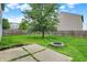 Backyard featuring a concrete patio, fire pit, and wood fence at 8212 Twin River Dr, Indianapolis, IN 46239