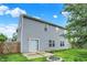 Home exterior, showcasing vinyl siding, a patio, and fire pit at 8212 Twin River Dr, Indianapolis, IN 46239