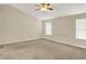 Large bedroom boasting vaulted ceiling, bright windows, and ceiling fan at 8212 Twin River Dr, Indianapolis, IN 46239