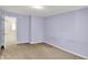 Carpeted bedroom with purple walls and white doors at 8212 Twin River Dr, Indianapolis, IN 46239