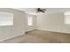 Bedroom featuring neutral paint, ceiling fan, and bright windows at 8212 Twin River Dr, Indianapolis, IN 46239