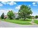 Charming two-story home featuring blue siding, brick accents, and well-manicured lawn and sidewalk access at 8212 Twin River Dr, Indianapolis, IN 46239