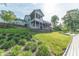 Secluded backyard with a lakeside view and a house with multiple balconies at 9172 W Tulip Dr, Columbus, IN 47201