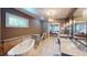 Luxurious bathroom with freestanding tub and chandelier, seamlessly connected to the main bedroom at 9172 W Tulip Dr, Columbus, IN 47201