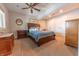 Inviting bedroom with a ceiling fan and natural light from the window at 9172 W Tulip Dr, Columbus, IN 47201