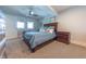 Comfortable bedroom featuring a ceiling fan, neutral colors, and carpeted floors at 9172 W Tulip Dr, Columbus, IN 47201