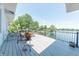 Expansive deck provides stunning water views and ample space for relaxation and outdoor enjoyment at 9172 W Tulip Dr, Columbus, IN 47201