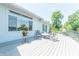 Large deck with outdoor seating offers a great space for relaxation and scenic views of the surrounding landscape at 9172 W Tulip Dr, Columbus, IN 47201