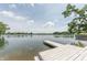 Wooden dock extends into a calm lake, offering easy access to the water for boating and recreation at 9172 W Tulip Dr, Columbus, IN 47201