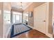 Welcoming foyer with hardwood floors, elegant lighting, and a beautiful entryway rug at 9172 W Tulip Dr, Columbus, IN 47201