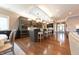 Spacious kitchen boasts dark cabinets, granite countertops, and an oversized island with seating at 9172 W Tulip Dr, Columbus, IN 47201