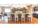 Modern kitchen with a large island, stylish bar stools, and stainless steel appliances at 9172 W Tulip Dr, Columbus, IN 47201