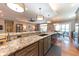 Expansive granite countertop island in a well-appointed kitchen with modern fixtures at 9172 W Tulip Dr, Columbus, IN 47201