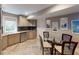 Charming kitchenette with wood cabinets, stainless steel dishwasher, and herringbone pattern tile floors at 9172 W Tulip Dr, Columbus, IN 47201