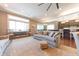 Spacious living room featuring large windows, hardwood floors, and stylish decor at 9172 W Tulip Dr, Columbus, IN 47201