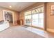 Living room with a sliding glass door to the deck, providing a seamless indoor-outdoor living experience at 9172 W Tulip Dr, Columbus, IN 47201