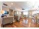 Open-concept living room featuring hardwood floors, modern lighting, and a seamless flow to the kitchen at 9172 W Tulip Dr, Columbus, IN 47201