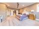 Serene main bedroom with ensuite bathroom, featuring carpeted floors, and a well-lit atmosphere at 9172 W Tulip Dr, Columbus, IN 47201
