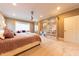 Spacious main bedroom boasts an elegant ceiling fan and a comfortable sitting area at 9172 W Tulip Dr, Columbus, IN 47201