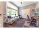 Cozy office space with a large window, comfortable seating, and ample natural light at 9172 W Tulip Dr, Columbus, IN 47201