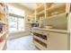 Organized pantry with window offers abundant shelving and storage space for all your kitchen essentials at 9172 W Tulip Dr, Columbus, IN 47201