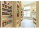 Walk-in pantry with ample shelving, providing generous storage space for all your needs at 9172 W Tulip Dr, Columbus, IN 47201